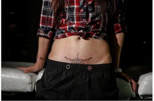 mothers make tattoo over c-section scars